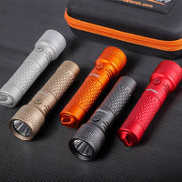 Five flashlights in different colors with a carrying case on a textured surface