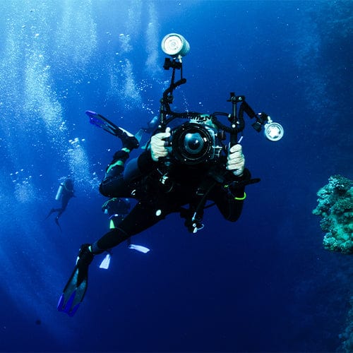 Diver holding an underwater camera