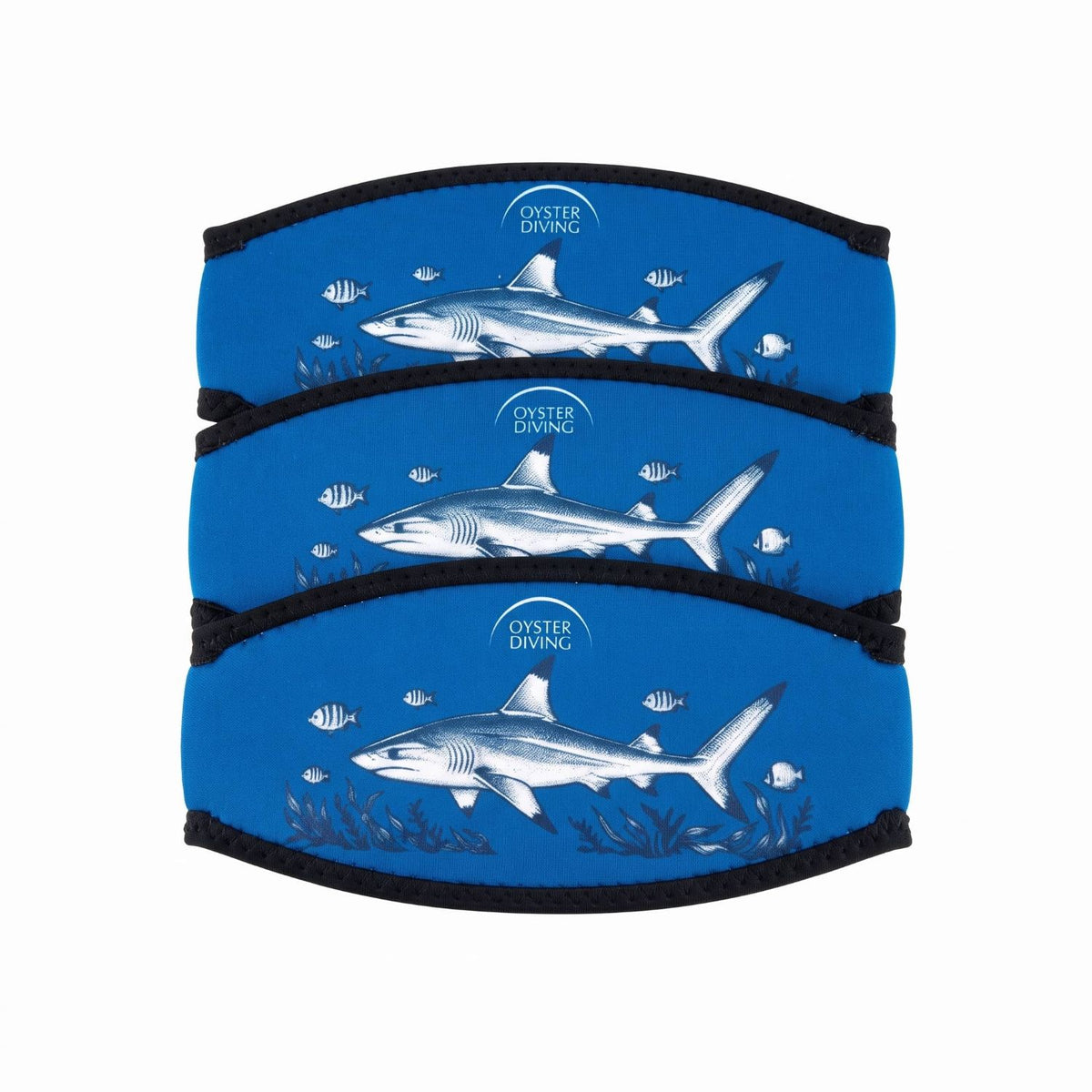 Three Oyster Diving shark neoprene mask strap covers stacked, showing the blue shark print and black bound edges