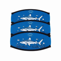 Three Oyster Diving shark neoprene mask strap covers stacked, showing the blue shark print and black bound edges